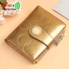 RFID protected golden patent leather women's wallet with embossed circles, button closure, and zipper for daily use.