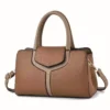 Brown faux leather handbag with top handles, front flap, and detachable shoulder strap for daily use.