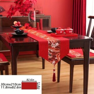 Red linen table runner with gold koi fish pattern, tassel, for dining table decor.
