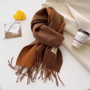 Reversible brown & orange cashmere blend scarf with fringe, cozy winter accessory.
