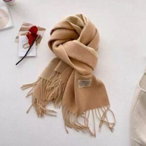 Soft cashmere blend scarf, beige and light brown ombre with fringe, for winter warmth and style.