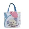 White canvas tote bag with blue handles, pink flower, and cute puppy on skateboard design, for kids' daily use.