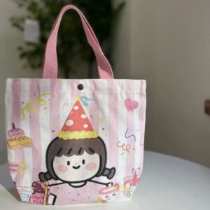 Pink striped canvas tote bag with cartoon girl in party hat, cakes, and confetti design, for gifts or daily use.