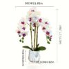 Artificial white and purple phalaenopsis orchid plant in a white marble-patterned ceramic pot for home decor.