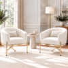 Pair of cream velvet barrel accent chairs with gold metal legs, for living room or bedroom seating.