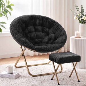Black faux fur saucer chair with gold metal frame and matching ottoman for cozy living room seating.