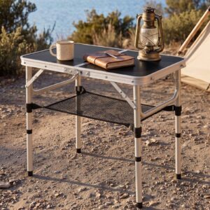 Black aluminum folding camping table with mesh storage shelf, perfect for outdoor picnics.